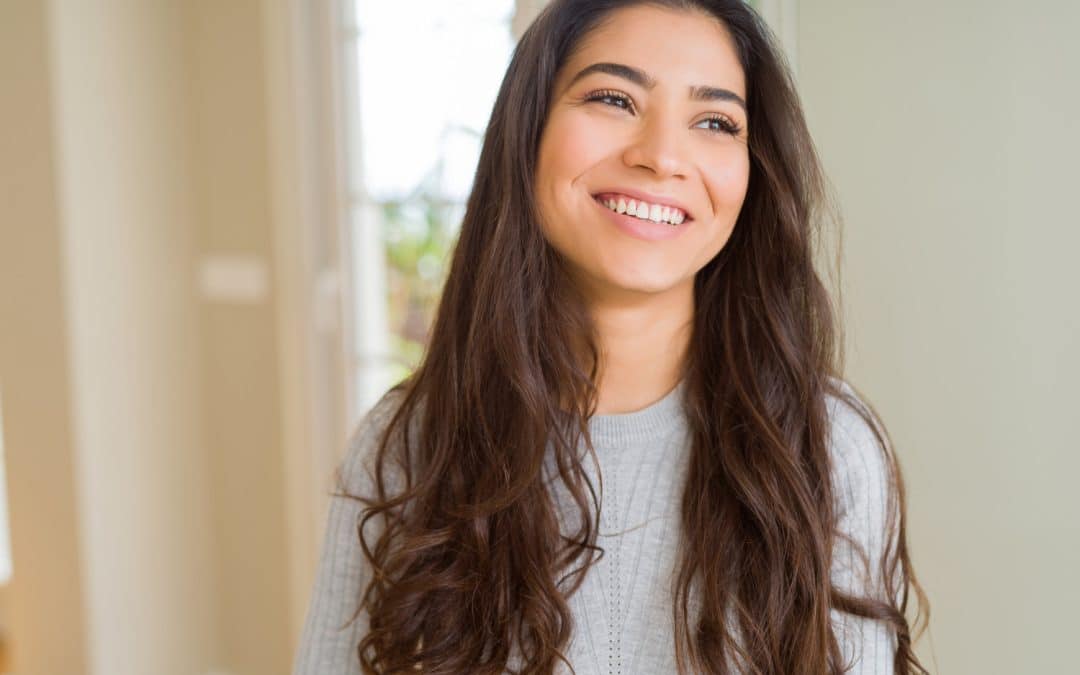 Woman maintaining her cosmetic dental procedures with the help of Glen Forest Dental Company in Richmond VA